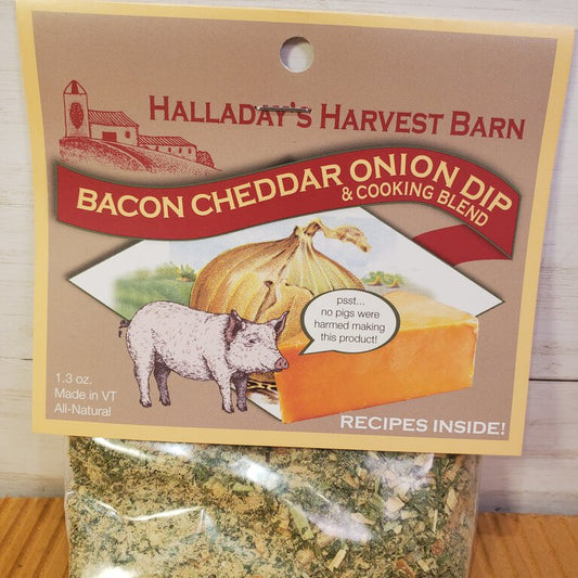 Packaging of Bacon Cheddar Onion Herb Dip mix showing the product name, an image of bacon and cheese, and a small window displaying the dip mix.