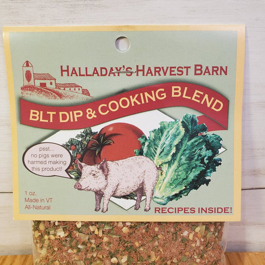 Packaging of BLT Herb Dip & Cooking Blend by Halladay's Harvest Barn, featuring an image of a pig, lettuce, and tomato, indicating the flavors of the product.