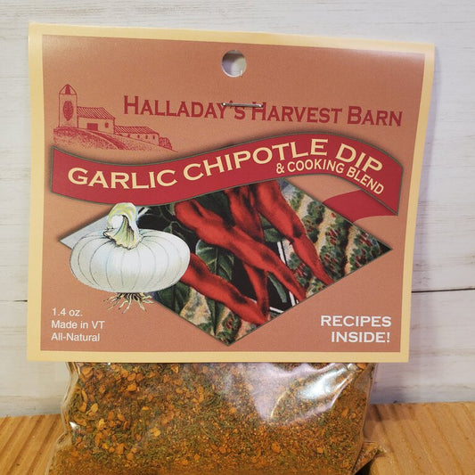 Packaging of Garlic Chipotle Herb Dip mix, showing the product name, an image of garlic and chipotle, and a transparent window revealing the dip inside the bag.