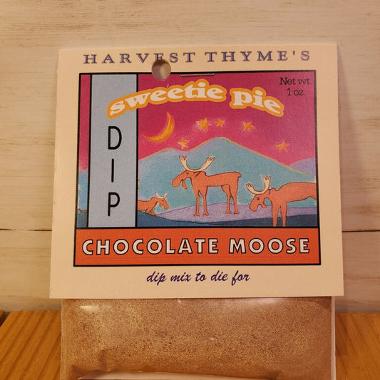 Packaging of Chocolate Moose Sweet Dip Mix by Harvest Thyme, featuring an illustration of a moose and berries on a mountainside.