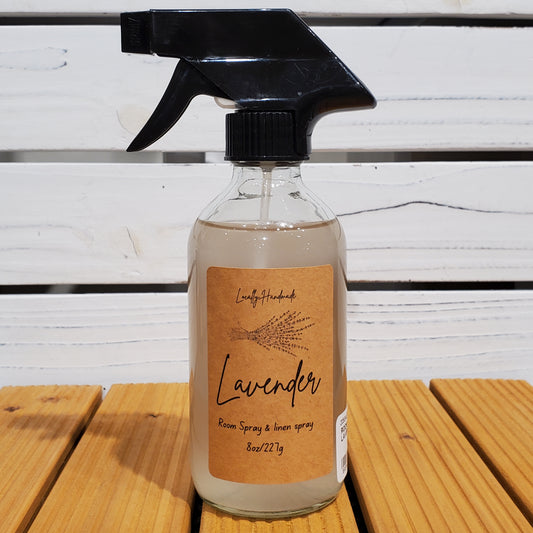 Spray bottle with a brown label on a wooden surface