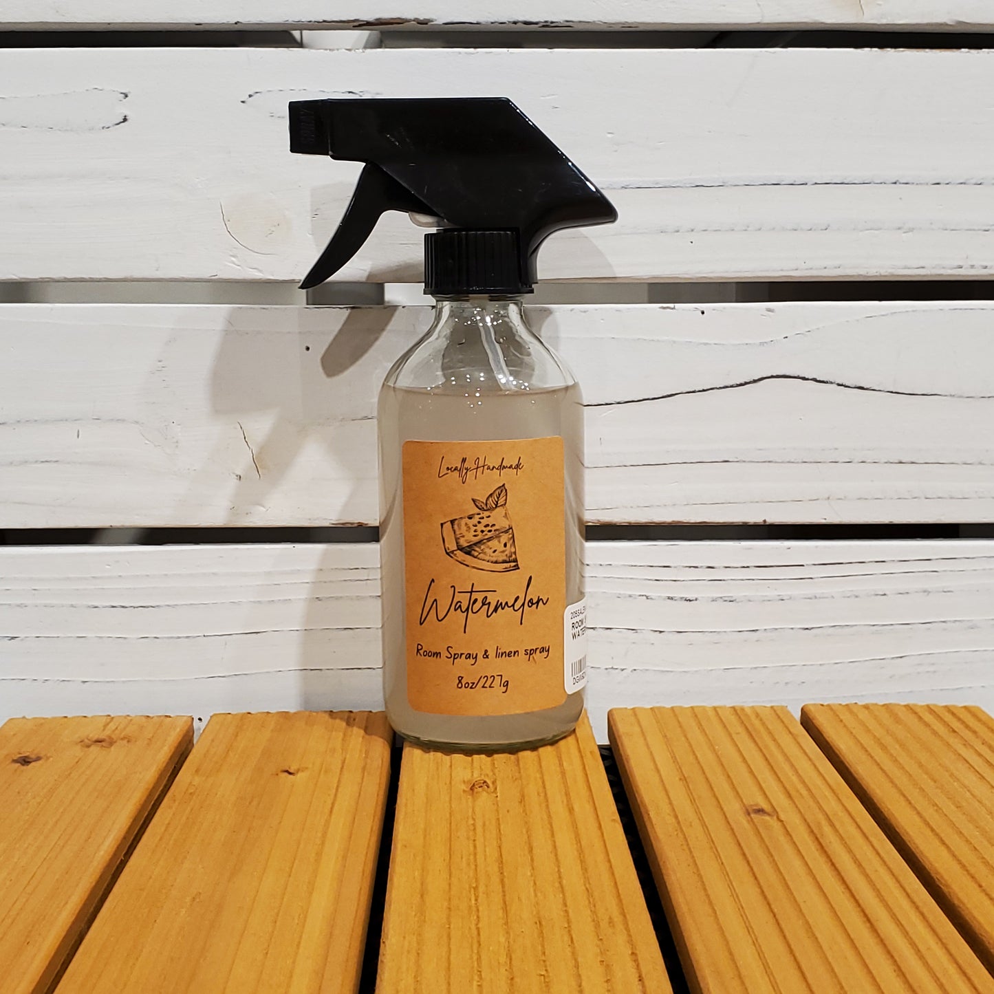 Bottle of Wotans donner on a wooden surface with a white background