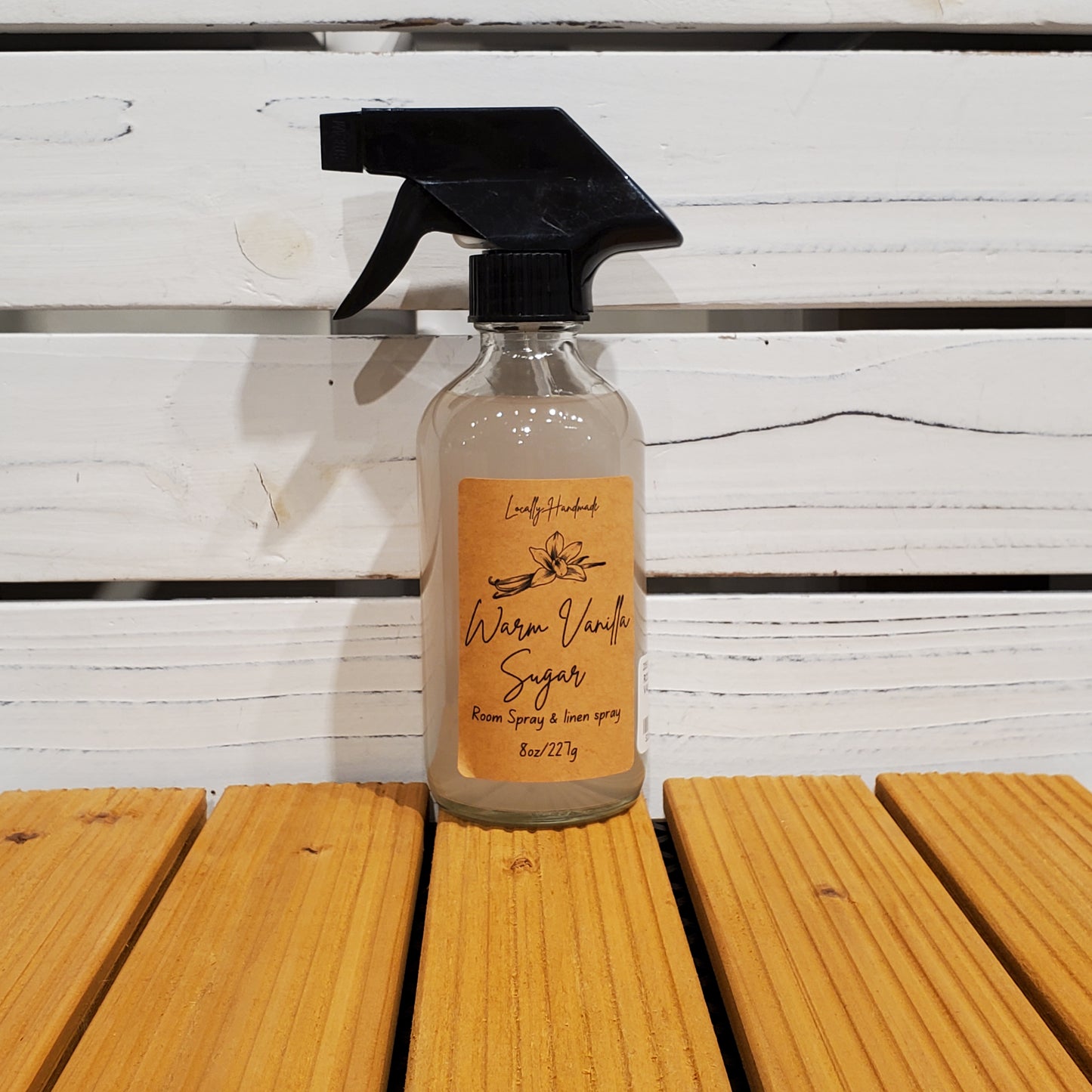Bottle of Wrenn & Wrenn spray on a wooden surface