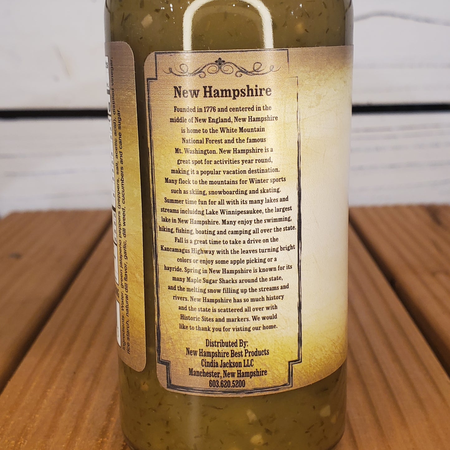 Bottle with a detailed label on a wooden surface