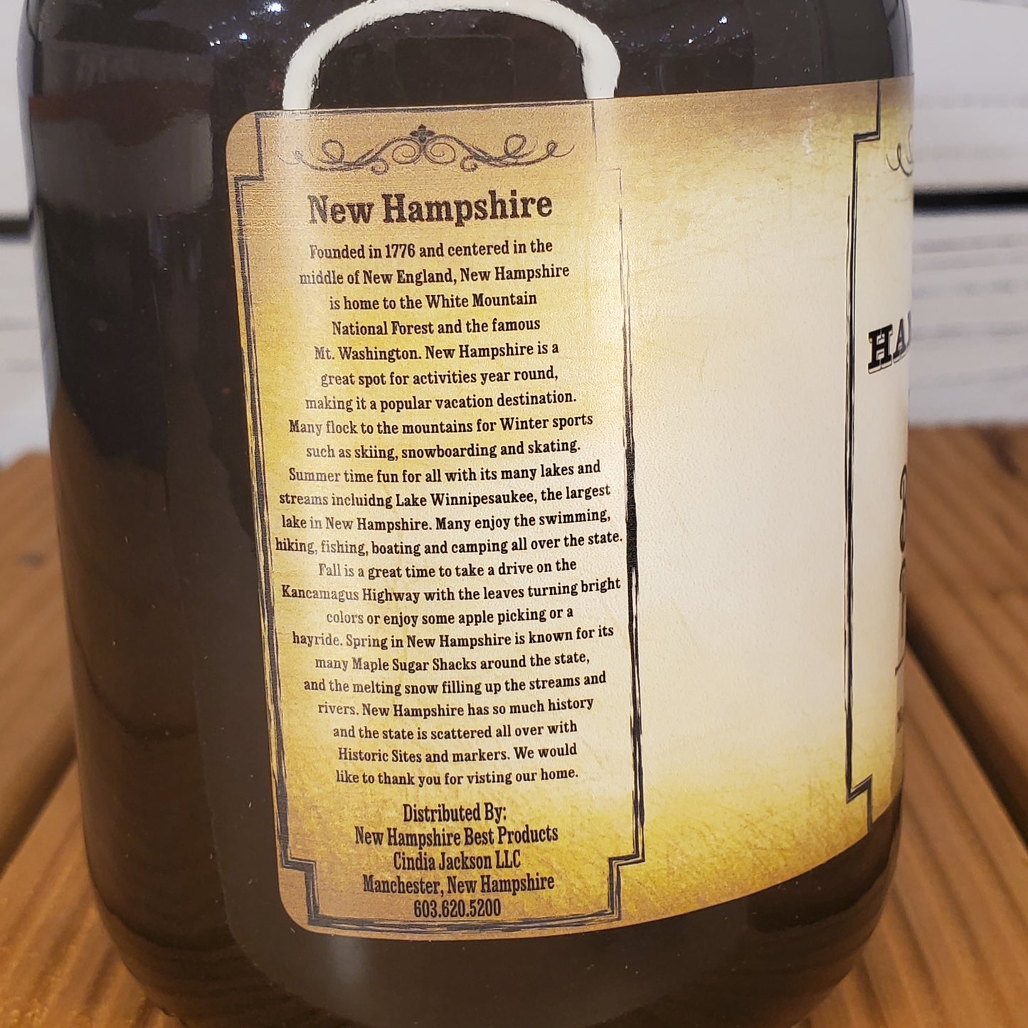 Wine bottle label with text on a wooden surface
