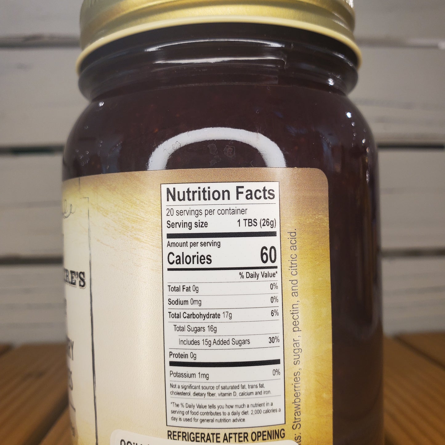 Close-up of a jar with a nutrition facts label on a white background