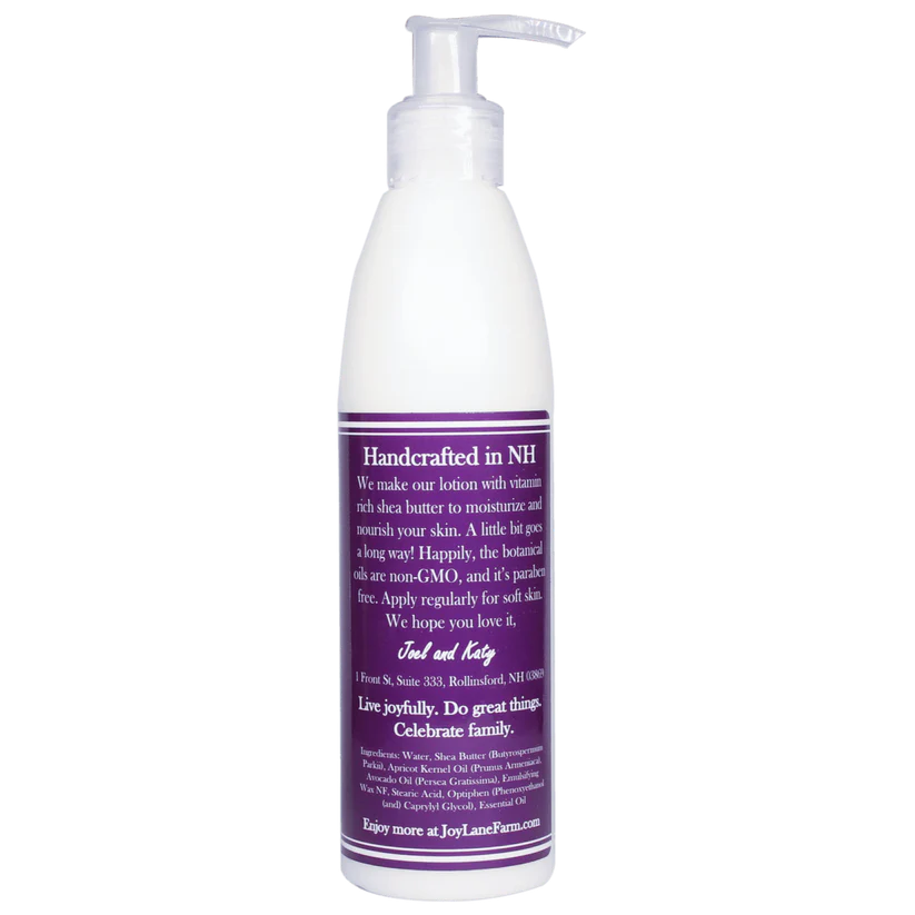 White lotion bottle with a purple label on a white background