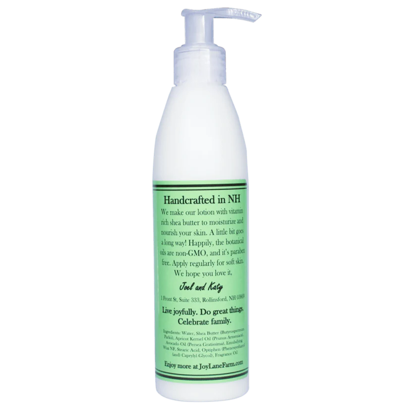 White lotion bottle with green label on a white background