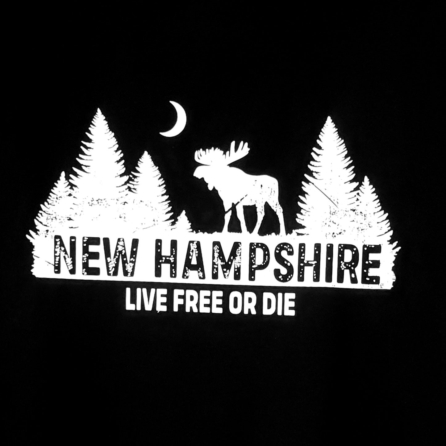 White graphic of a moose between trees with 'New Hampshire Live Free or Die' text on a black background