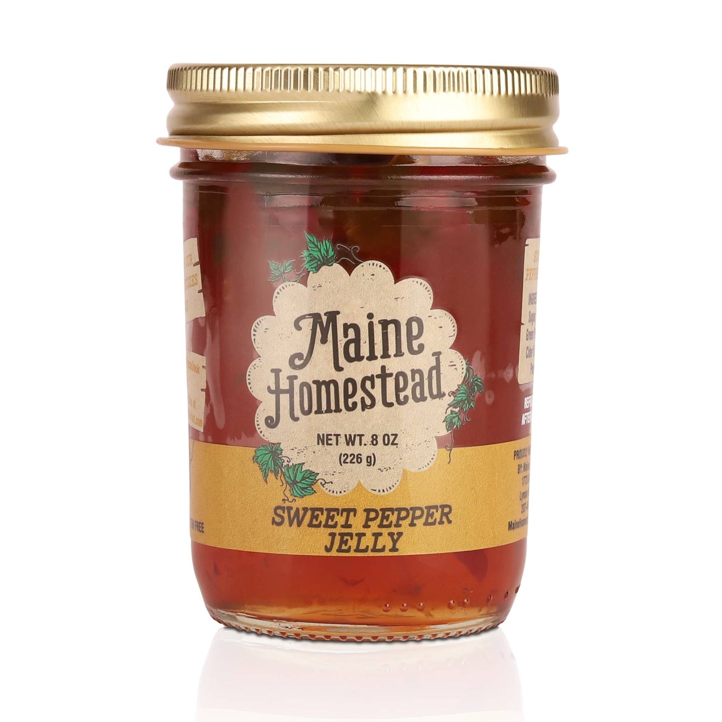 Jar of Maine Homestead Sweet Pepper Jelly with a gold lid on a white background