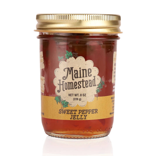 Jar of Maine Homestead Sweet Pepper Jelly with a gold lid on a white background