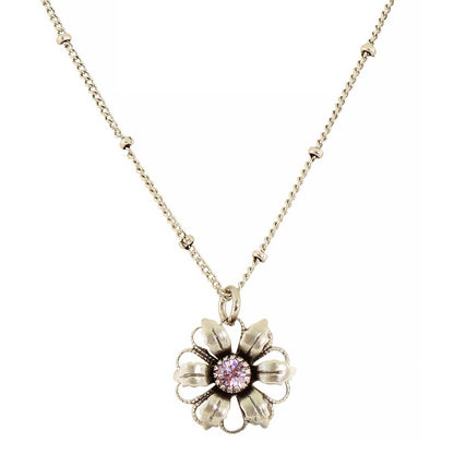 A silver-tone flower pendant necklace with a pink gemstone center, suspended on a delicate silver chain against a plain white background.