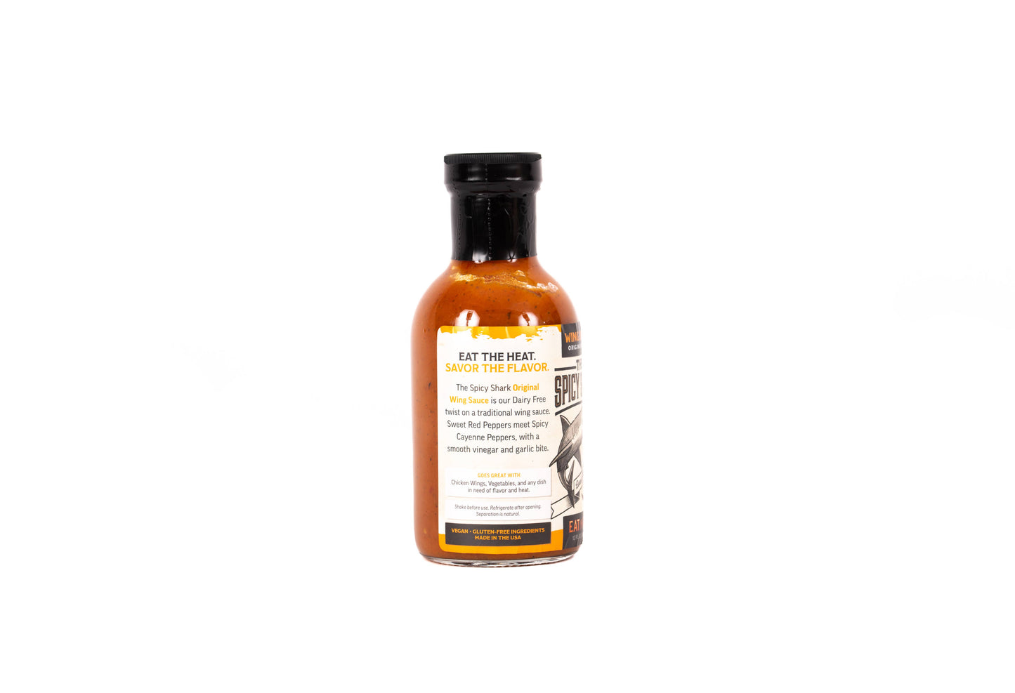 A bottle of Eat The Heat Sauce The Flavor spicy hot sauce on a solid white background.