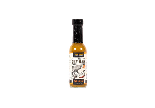Bottle of spicy sauce on a white background