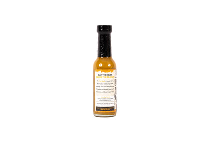 Hot sauce bottle with label on a white background