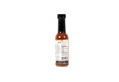 Hot sauce bottle with label on a white background