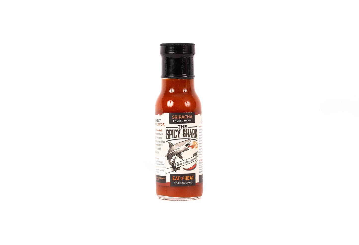 A bottle of Shirelac Farms 'The Spicy Shade' hot sauce on a plain white background.