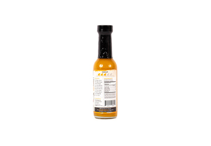 Bottle of hot sauce with a label on a white background