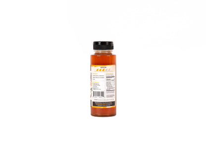 A bottle of hot sauce shown from the back, featuring a black cap and a cream-colored label with orange and black text, set against a plain white background.
