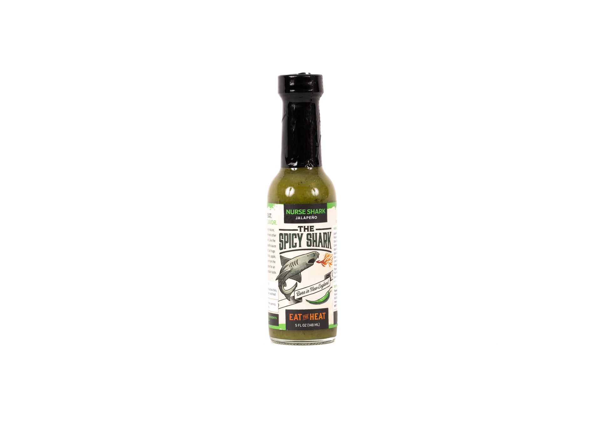Bottle of spicy sauce with a label on a white background