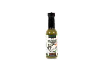 Bottle of spicy sauce with a label on a white background