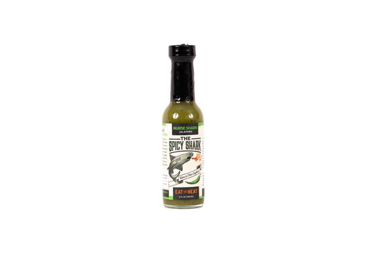 Bottle of spicy sauce with a label on a white background