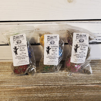 Three sealed plastic packages of Catnip O Nip Balls, each with a different color of catnip balls visible inside.