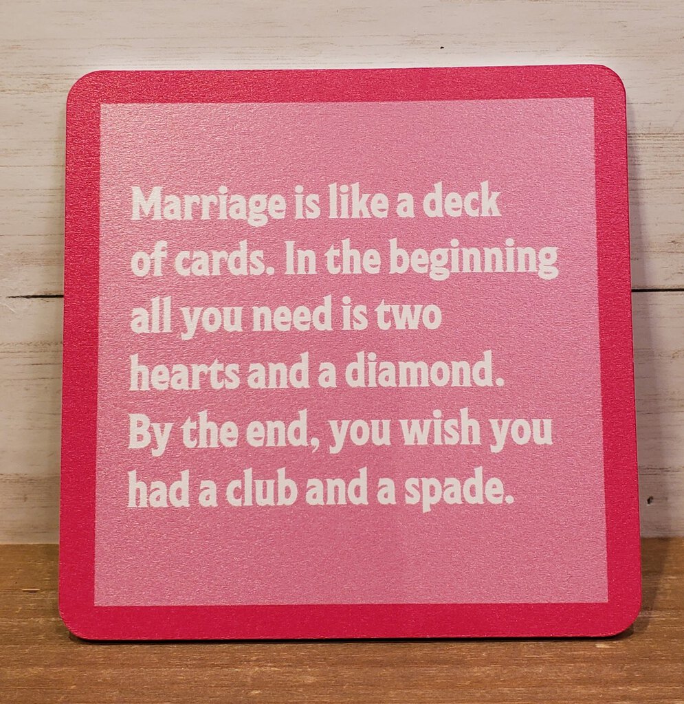 A red square coaster with white text that reads: 'Marriage is like a deck of cards. In the beginning all you need is two hearts and a diamond.
