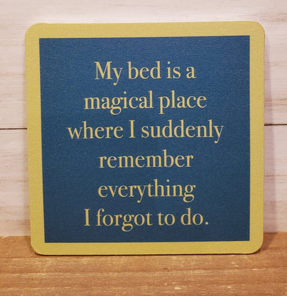 A square coaster with a blue center and yellow border. The coaster has text on it.