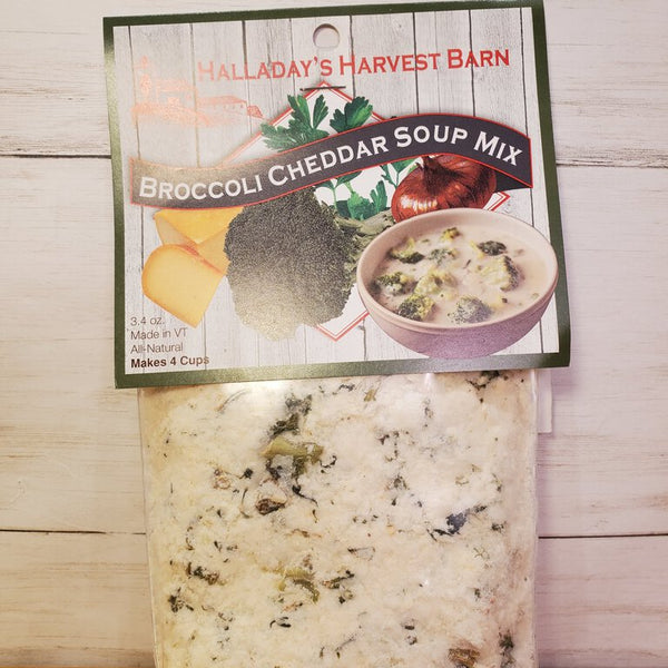 Packaged Broccoli Cheddar Soup Mix in a clear plastic bag with a label showing the product name and an image of the soup.