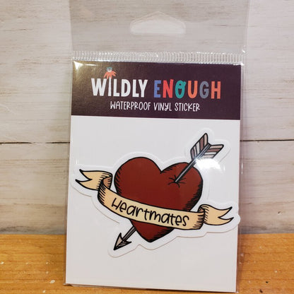 Packaging of a 'Wildly Enough' waterproof vinyl sticker with a heart and arrow design.