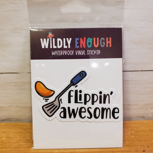 A vinyl sticker with the phrase 'flippin' awesome' printed on it, packaged on a card.