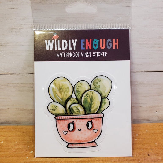 A vinyl sticker depicting a cartoon-style green succulent plant in a pink pot, packaged on a card with the text 'WILDLY ENOUGH WATERPROOF VINYL STICKER'.