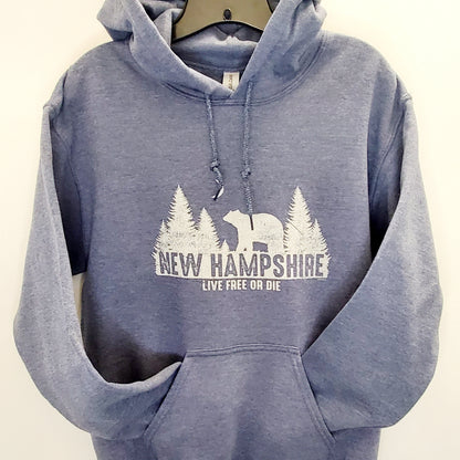 Blue hoodie with New Hampshire design on a beige background