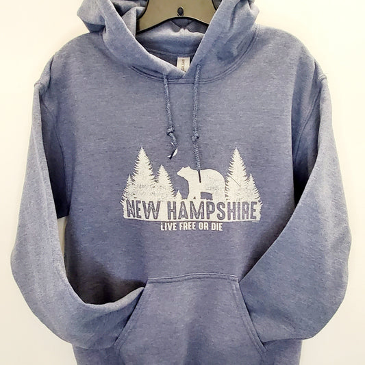 Blue hoodie with New Hampshire design on a beige background