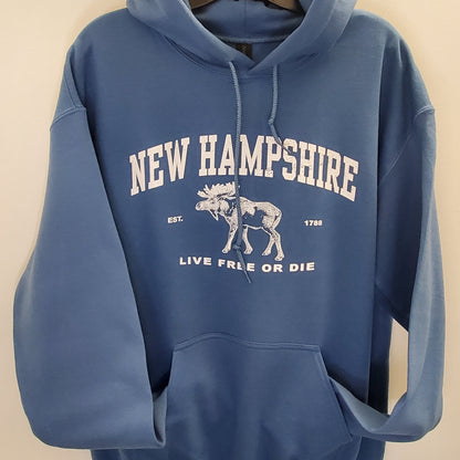 Blue hoodie with 'New Hampshire' and moose graphic on a beige background