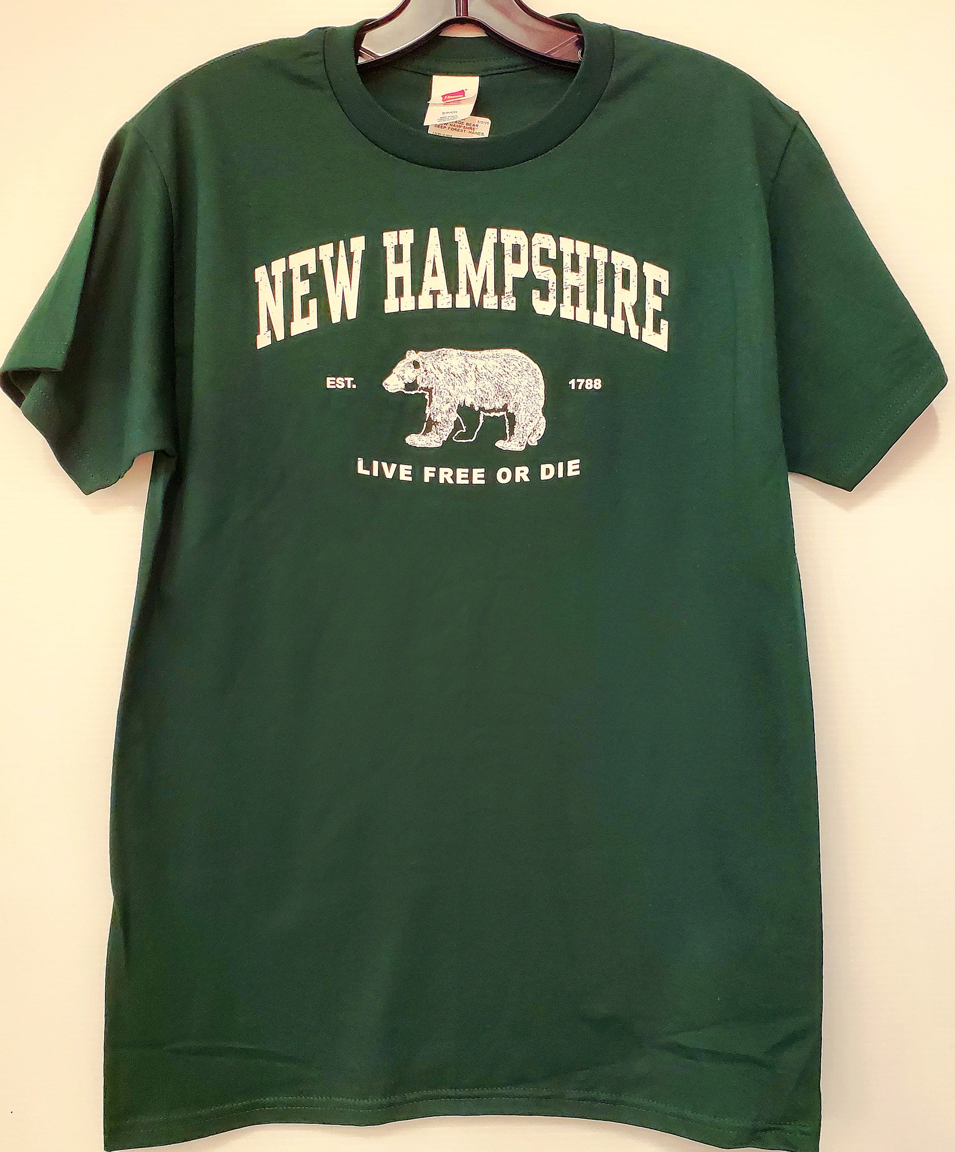 Green t-shirt with 'New Hampshire Live Free or Die' design on a white background