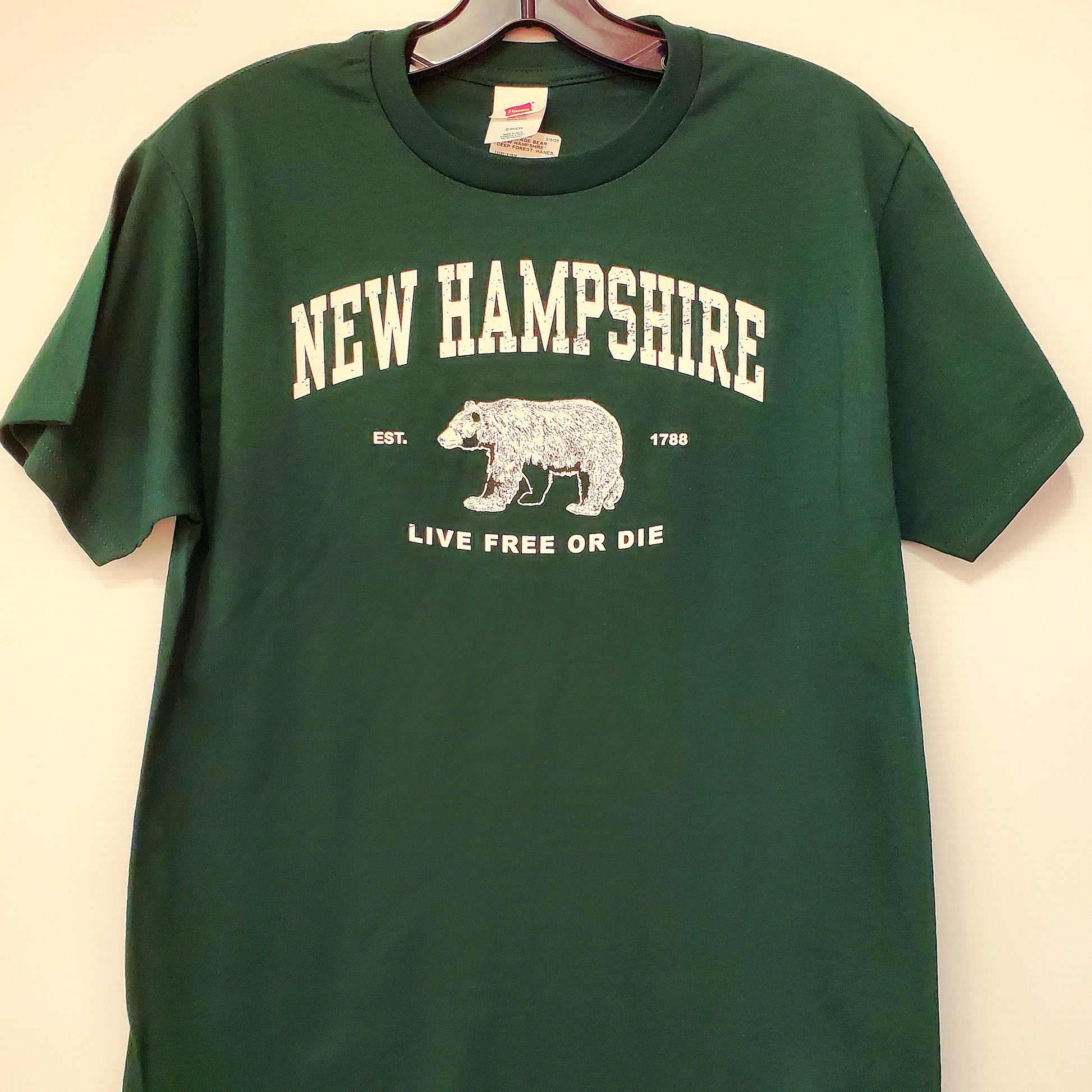 Green t-shirt with 'New Hampshire' and bear graphic on a white background
