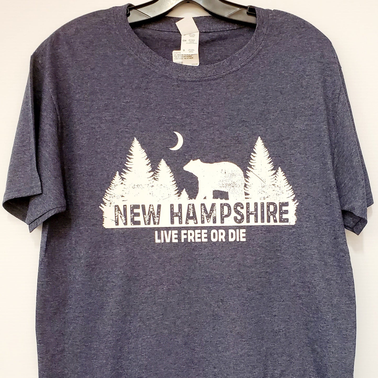 Blue t-shirt with New Hampshire graphic design on a white background