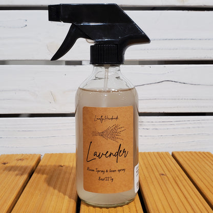 Spray bottle with a brown label on a wooden surface