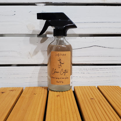 Bottle of clear coffee on a wooden surface with a white background