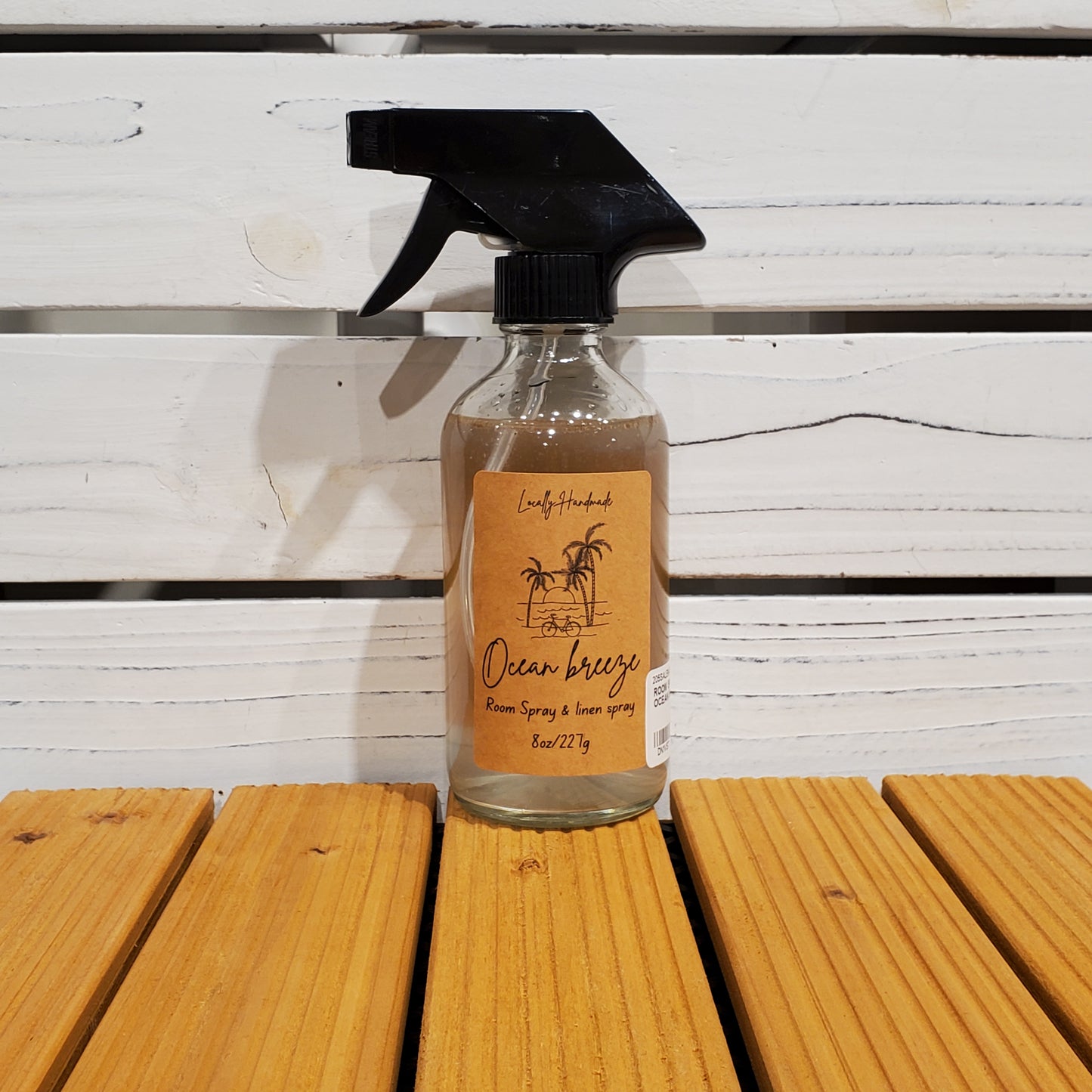 Spray bottle with a label on a wooden surface