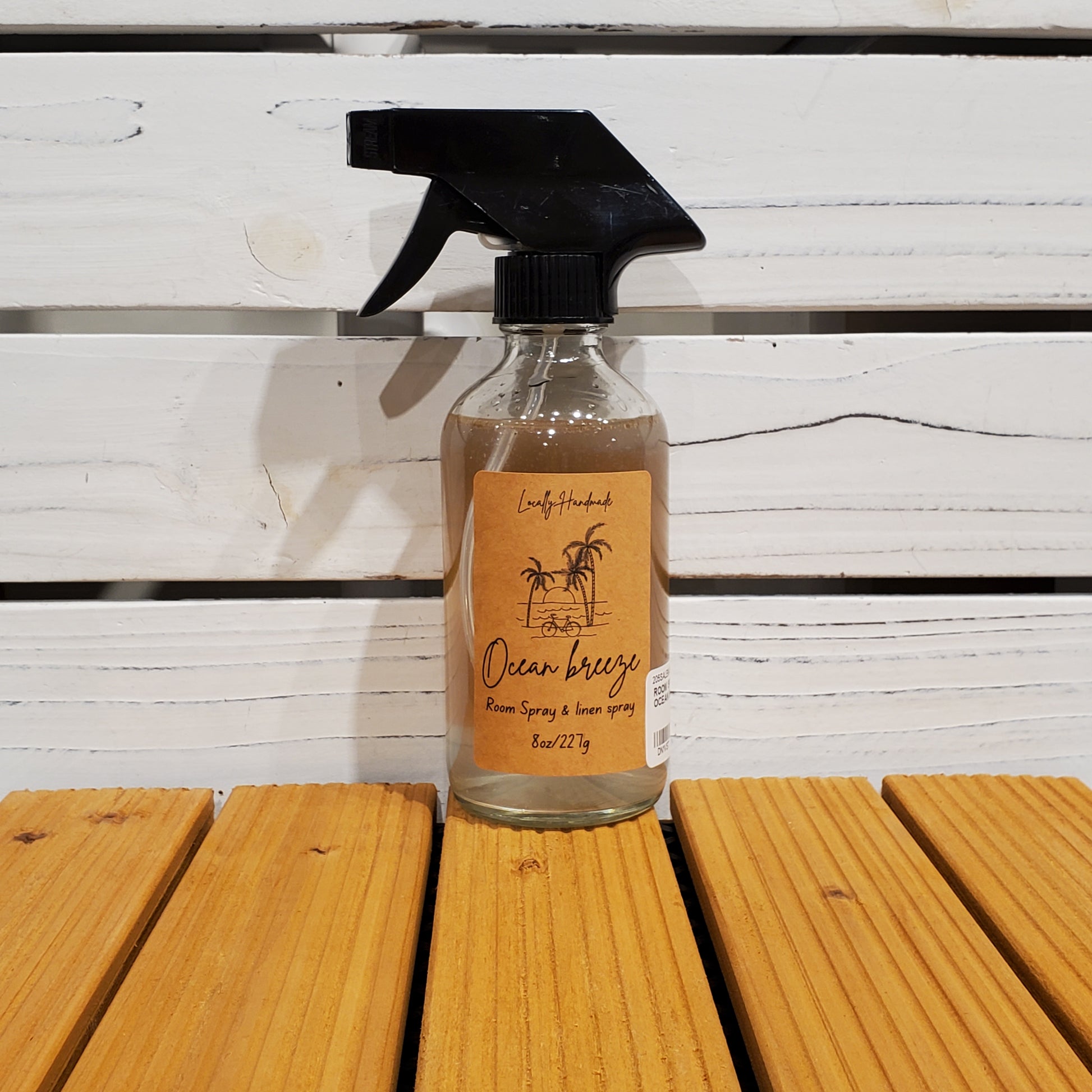 Spray bottle with a label on a wooden surface