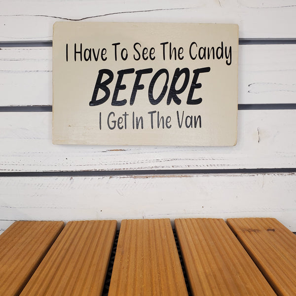 Sign with humorous text on a wooden surface