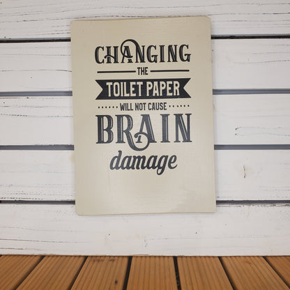 “Changing the Toilet Paper...” 8x10 White Wooden Sign.