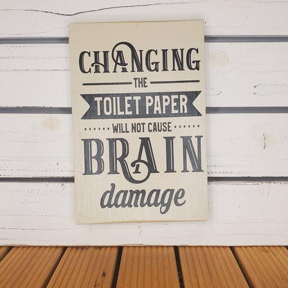 “Changing the Toilet Paper...” 6x8 White Wooden Sign.