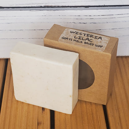 Bar of soap with a brown box labeled 'Misteria Lilac' on a wooden surface.