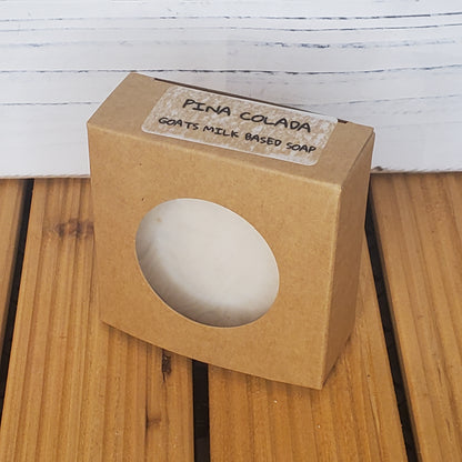 Goats' milk-based soap in a brown box on a wooden surface