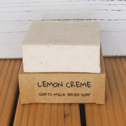 Bar of soap with a brown label on a wooden surface