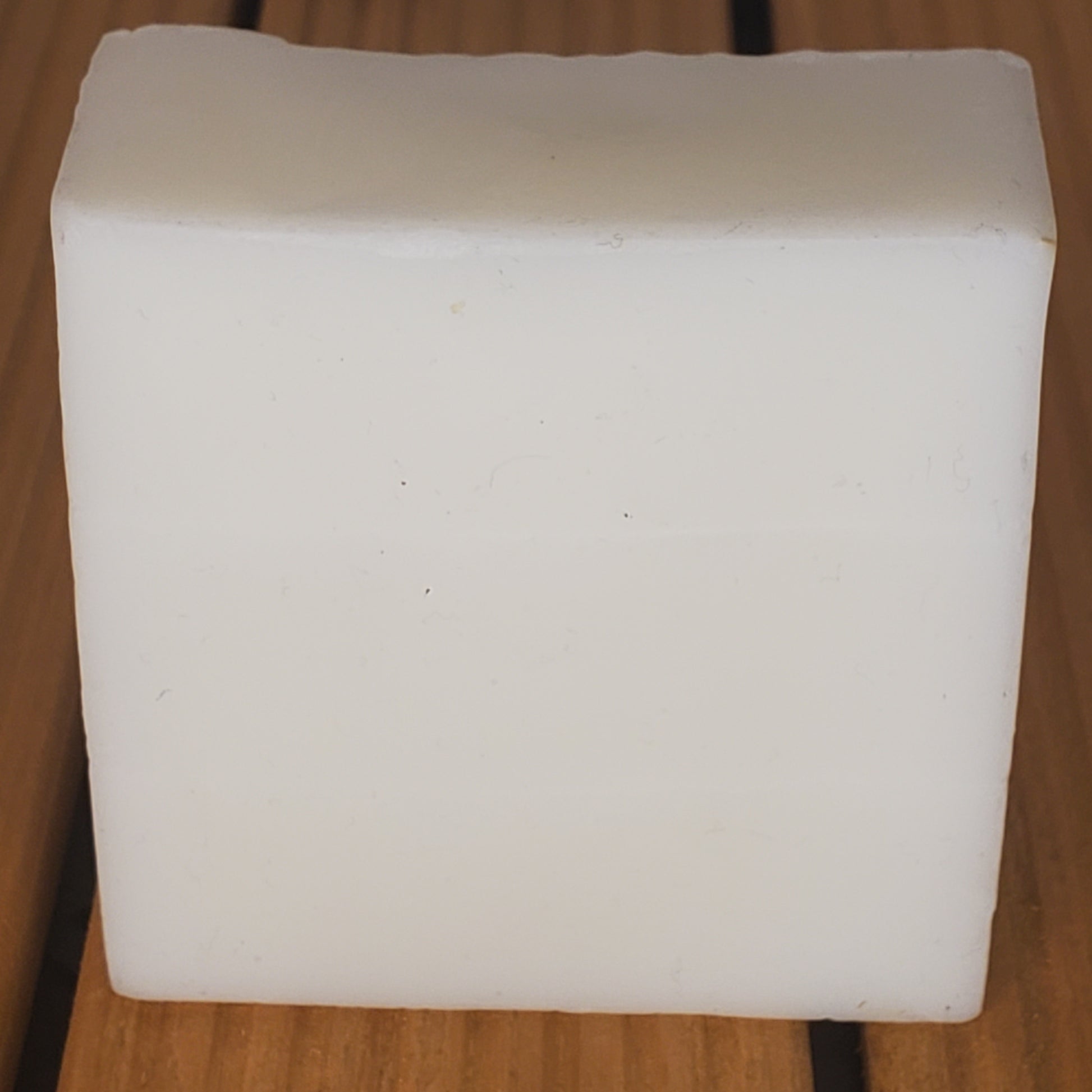 White square block on a wooden surface